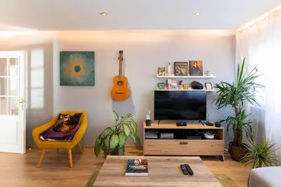 Télévision ou salle de divertissement dans l'établissement Le petit Nieder - Colmar Centre