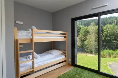 Un ou plusieurs lits dans un hébergement de l'établissement Villa pleine nature - piscine, jacuzzi, sauna
