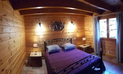Un ou plusieurs lits dans un hébergement de l'établissement Chalet Eras, Belle vue lac, Sauna, Wifi