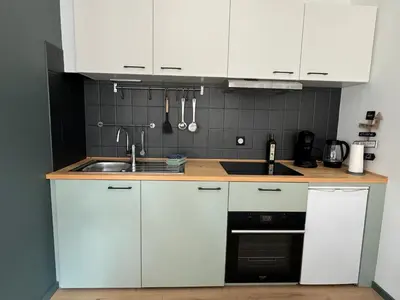 Cuisine ou kitchenette dans l'établissement L'arbalète - Centre ville - 2 personnes