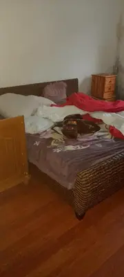 Un ou plusieurs lits dans un hébergement de l'établissement Privat Zimmer in eine whg rue des abeilles