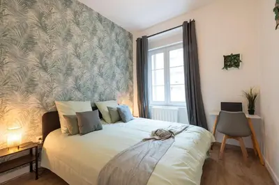 Un ou plusieurs lits dans un hébergement de l'établissement MonSéjourCosy - L'Escapade - Spacieux - Netflix
