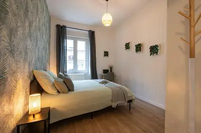 Un ou plusieurs lits dans un hébergement de l'établissement MonSéjourCosy - L'Escapade - Spacieux - Netflix