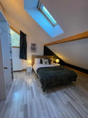 Un ou plusieurs lits dans un hébergement de l'établissement Chalet Villa Piscine vue panoramique sur Gérardmer et le Hohneck