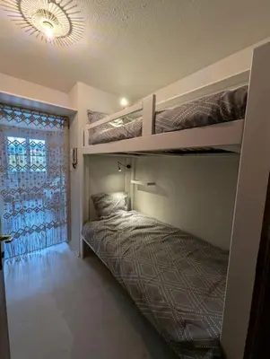 Un ou plusieurs lits dans un hébergement de l'établissement Chez Paulette, Studio cosy au centre ville de Gérardmer