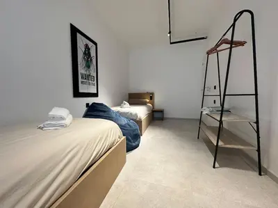 Un ou plusieurs lits dans un hébergement de l'établissement Le Big Stork - Appartement - Centre Historique