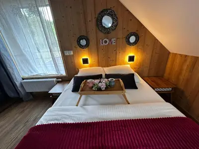 Un ou plusieurs lits dans un hébergement de l'établissement Chalet Bois de Rose