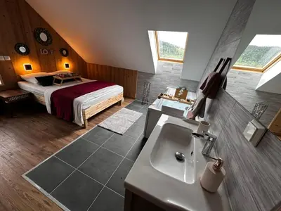 Un ou plusieurs lits dans un hébergement de l'établissement Chalet Bois de Rose