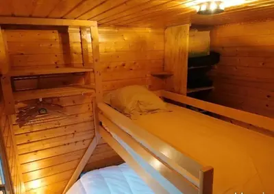 Un ou plusieurs lits dans un hébergement de l'établissement Le chalet de l'Ange - gîte - bain nordique
