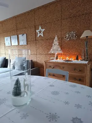 Un ou plusieurs lits dans un hébergement de l'établissement Charmante maison familiale