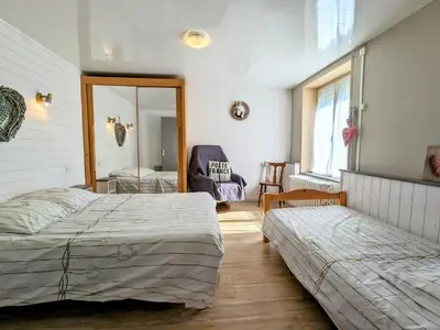 Un ou plusieurs lits dans un hébergement de l'établissement Appartement cosy à La Bresse avec terrasse et parking, animaux admis - FR-1-589-689