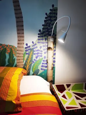 Un ou plusieurs lits dans un hébergement de l'établissement Appartement-maison avec jardin