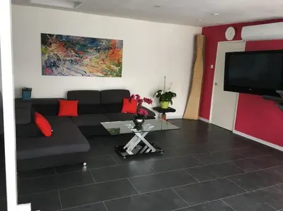 Télévision ou salle de divertissement dans l'établissement Loft le nid de cigogne