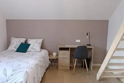 Un ou plusieurs lits dans un hébergement de l'établissement Maison La Belfort You proche TechnHom
