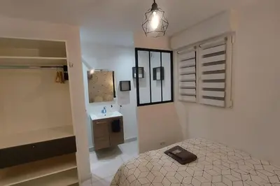 Un ou plusieurs lits dans un hébergement de l'établissement Maison La Belfort You proche TechnHom