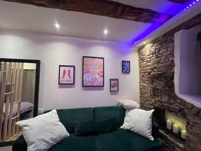 Un ou plusieurs lits dans un hébergement de l'établissement Studio Charme Huningue Abbatucci