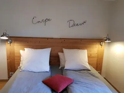 Un ou plusieurs lits dans un hébergement de l'établissement Chambres d'hôtes à la montagne, animaux acceptés - FR-1-589-735