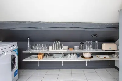 Cuisine ou kitchenette dans l'établissement Le Lumina - style et confort au centre