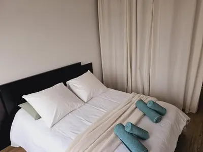 Un ou plusieurs lits dans un hébergement de l'établissement Appartement avec Parking Centre Ville Mulhouse