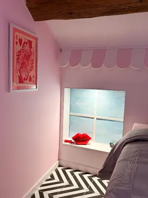 Un ou plusieurs lits dans un hébergement de l'établissement Chambre Disco Paradisio