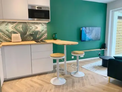Télévision ou salle de divertissement dans l'établissement Tiny house avec terrasse privée