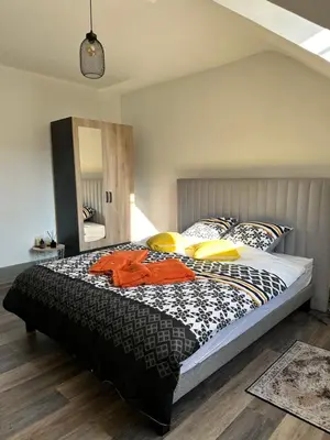 Un ou plusieurs lits dans un hébergement de l'établissement Jardin de Victor Appartements calmes spacieux avec jardin clos