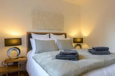 Un ou plusieurs lits dans un hébergement de l'établissement Maison cosy et bien située