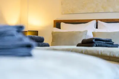 Un ou plusieurs lits dans un hébergement de l'établissement Maison cosy et bien située