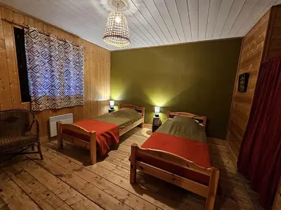 Un ou plusieurs lits dans un hébergement de l'établissement Le Nénuphar - Chalet avec terrasse
