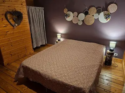 Un ou plusieurs lits dans un hébergement de l'établissement Le Nénuphar - Chalet avec terrasse