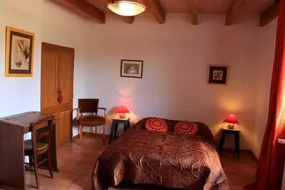 Un ou plusieurs lits dans un hébergement de l'établissement La Ferme - Maison avec terrasse