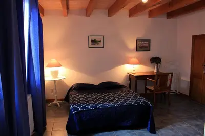 Un ou plusieurs lits dans un hébergement de l'établissement La Ferme - Maison avec terrasse