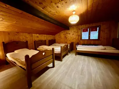 Un ou plusieurs lits dans un hébergement de l'établissement Le Grand Aigle, bel appartement style chalet