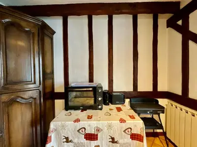 Un ou plusieurs lits dans un hébergement de l'établissement Le Grand Ours, appartement spacieux avec terrasse