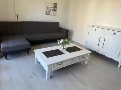 Coin salon dans l'établissement Appartement avec balcon et parking