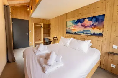 Un ou plusieurs lits dans un hébergement de l'établissement chalet zélcova et spa Gérardmer