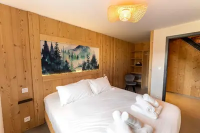 Un ou plusieurs lits dans un hébergement de l'établissement chalet zélcova et spa Gérardmer
