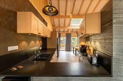 Cuisine ou kitchenette dans l'établissement chalet zélcova et spa Gérardmer
