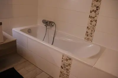 Salle de bains dans l'établissement Le Chalet de la Rivière