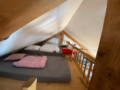 Un ou plusieurs lits dans un hébergement de l'établissement Loft des Cimes - Evasion en montagne avec local vélo privé