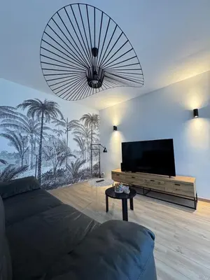 Télévision ou salle de divertissement dans l'établissement Maison des chênes