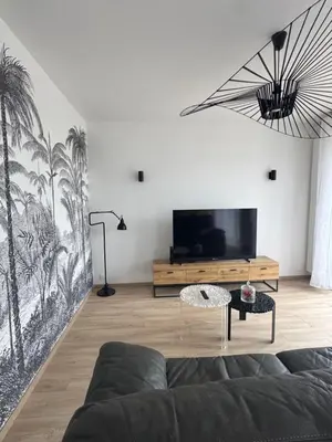Télévision ou salle de divertissement dans l'établissement Maison des chênes