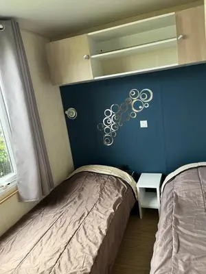 Un ou plusieurs lits dans un hébergement de l'établissement Mobile home