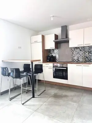 Cuisine ou kitchenette dans l'établissement Start appart