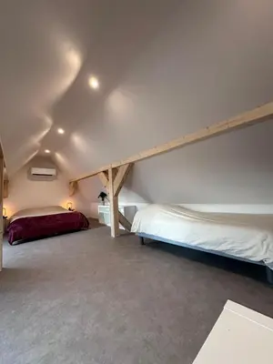 Un ou plusieurs lits dans un hébergement de l'établissement Appartement 2023