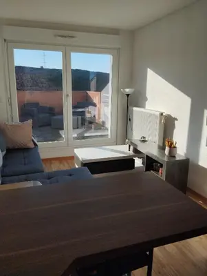 Coin salon dans l'établissement Escapade cosy dans T2 lumineux, proche Colmar
