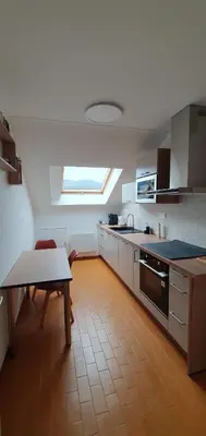 Cuisine ou kitchenette dans l'établissement Gîte Les Bleuets