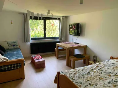 Coin salon dans l'établissement Espace privé dans un parc arboré