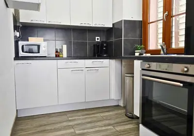 Cuisine ou kitchenette dans l'établissement La Petit Clé - Centre Ville