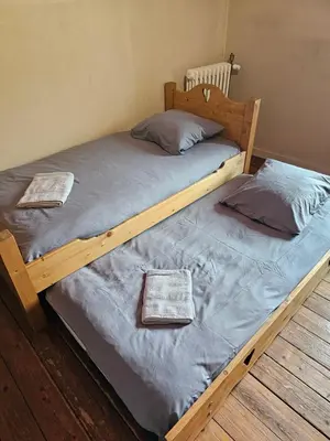Un ou plusieurs lits dans un hébergement de l'établissement La Demeure des Tisserands